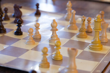This image shows a closeup of a chess board with chess pieces
