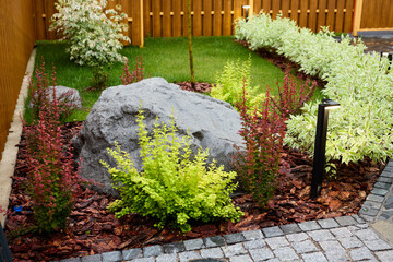 A Beautifully Designed Garden Featuring Rock Elements and Vibrant Colorful Shrubs and Flowers