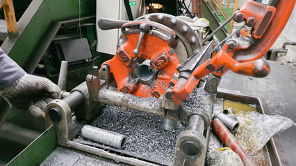 Steel pipe cutting and threading machine for plumbing work in factory, metal technology manufacturing equipment