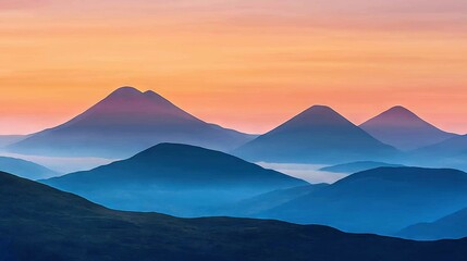   Mountains in distance with pink and blue sky in foreground, pink and orange sky in background