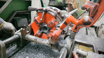 Steel pipe cutting and threading machine for plumbing work in factory, metal technology manufacturing equipment