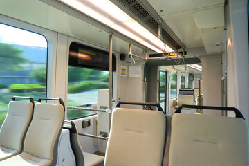 The interior and seats of a moving tram, one of the urban transportation vehicles.