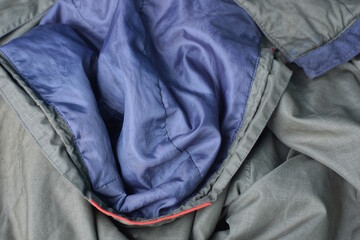 fabric texture of gray hood green wrinkled jacket