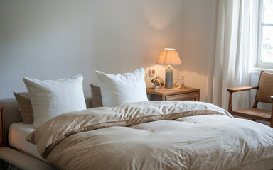 Elegant and cozy bedroom design featuring neutral colors and soft lighting for relaxation