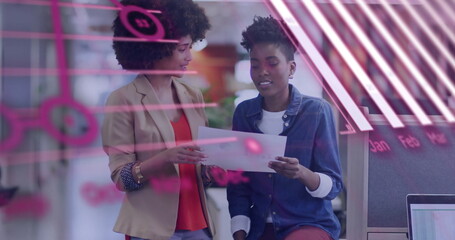 Image of financial data processing over diverse colleagues discussing work in office