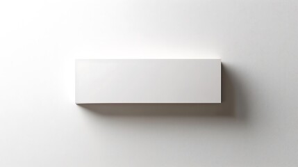 A white box with a black border sits on a white wall