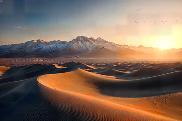 Fototapeta premium sunset over the desert , the dunes and mountains in the background.