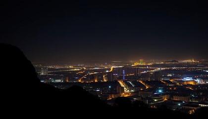 Obraz premium Nighttime Cityscape Illuminated Buildings Skyline View