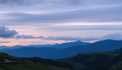 Fototapeta premium Serene Sunset Over Rolling Blue Mountainscape