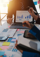 Meeting of business executives discussing analysis of the company's financial situation and...