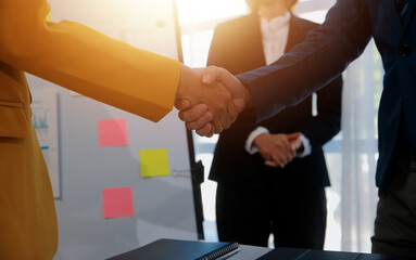 Hand shake business,Young business people shaking hands in the office. Finishing successful...