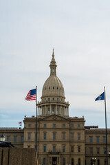 Michigan State Capitol Dome with American and State Flags with Copy-Space