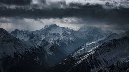 Obraz premium Ominous Aerial Shot of the Alps, France/Switzerland Aerial view of the Alps under storm clouds