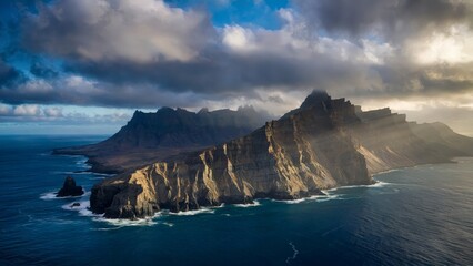 Cape Horn Dramatic Daylight . An aerial view of Cape Horn in Chile under dramatic clouds, showcasing the rugged cliffs plunging into the deep blue ocean.