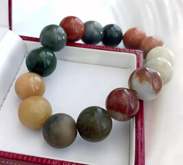 Colorful Beaded Bracelet Display in a Red and White Jewelry Box
