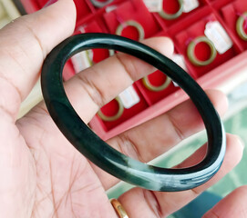 Elegant Dark Green Jade Bangle in Hand