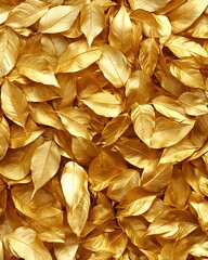 A close-up view of shiny golden leaves scattered across a surface.