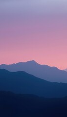 Fototapeta premium Silhouetted Mountains at Pink Sunset Sky