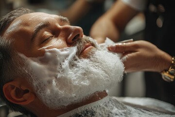 A man enjoys a luxurious shave  his face and beard lathered in rich shaving foam.