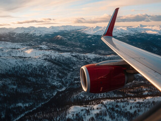 Aerial view of snow covered mountains from airplane window