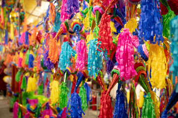 Fototapeta premium Piñatas season in a Mexican market, piñata background in christmas