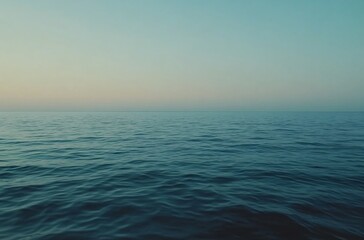 Obraz premium A vast and tranquil ocean stretching to the horizon, capturing the endless beauty of the Pacific or Atlantic, creating a perfect wallpaper with negative space for travel and commercial backgrounds.