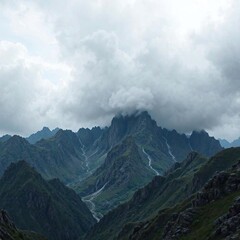 Obraz premium A rugged mountain range with dark gray clouds looming in the background, scenery, range, ominous