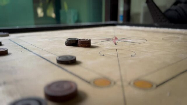 Close-up view of a wooden carrom board used as indoor sports