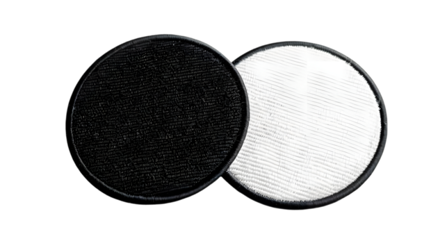 Blank black and white round embroidered patch mockup, top view isolated on a transparent background