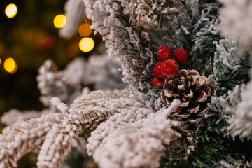 Close-up of branches of various Christmas trees that are for sale in a shopping mall. The trees...