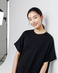 Asian beautiful woman in a black t-shirt, smile, confidently staring at the camera. standing on white background