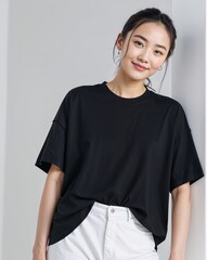 Asian beautiful woman in a black t-shirt, smile, confidently staring at the camera. standing on white background