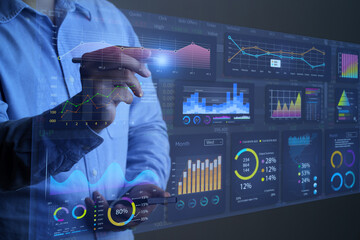 Businessman working with data management system on virtual screen.Analysis working with Financial...