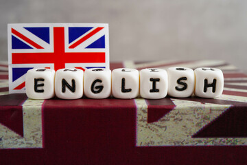 English book with graduate hat, learning and tutorial for foreigner.