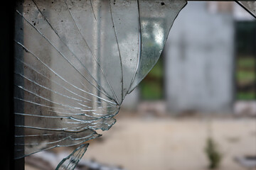 an abandoned broken windows. Old destroyed houses. Broken glass in the window. War, destruction,...