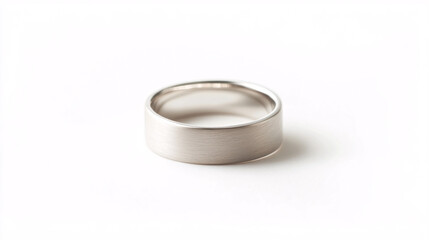 simple silver wedding band on white background
