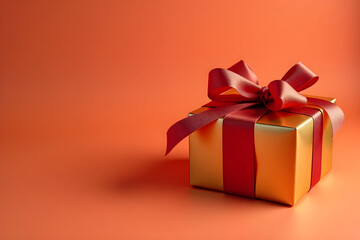 Fototapeta premium Gold gift box with red ribbon bow
