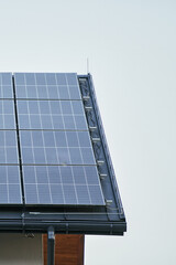 Solar panels producing energy on house roof