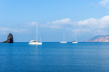 sailing yacht boats with white sails in blue sea . Luxury yachts Regata.Sailing in the wind through the waves at the Sea