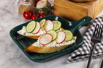 Bruschetta with soft cheese and radishes