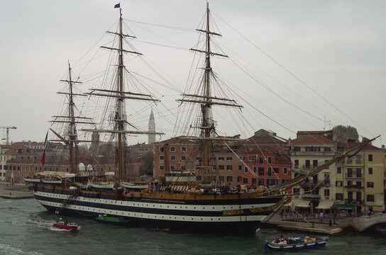 Italian marine or navy sailing cadetship or training ship Amerigo Vespucci docked in port of Venice, Italy on grey and foggy day