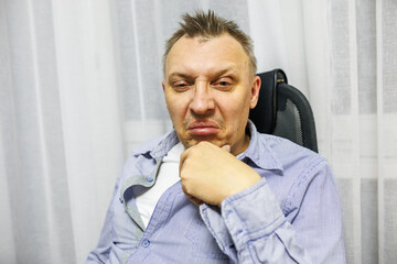 distorted face of a sad and sorrowful very upset man