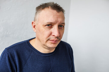 distorted face of a sad and sorrowful very upset man