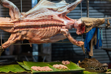 Grilled crocodile meat on the grill at khaosan road in Bangkok, Thailand