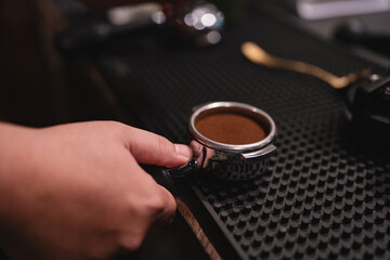In lively cafes, the barista expertly used the machine as a tool to tamp the espresso beans,...