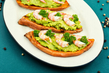 Sweet potato or yam with avocado and shrimp.