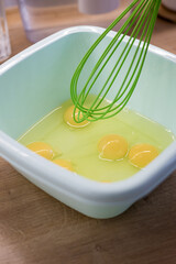 whisking eggs in bowl