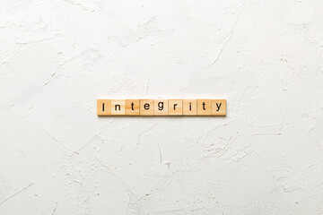 integrity word written on wood block. integrity text on table, concept