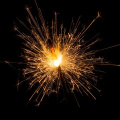 Obraz premium sparks with solid black background and also fire particles