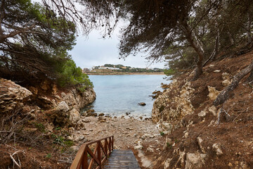 Shoreline wooden path. Cami de ronda. Lescala, Girona. Catalonia, Spain